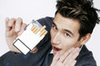 Man saying no to a box of cigarette.