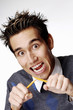 Photo: Man breaking a pencil. Man breaking a pencil.