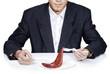 Photo: Businessman with a piece of meat. Businessman with a piece of meat.