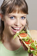 Woman eating baguette.