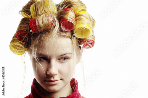 Photo: Woman with hair in curlers. Woman with hair in curlers.