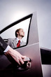 Hand opening car door for a businessman.