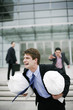 Businessman chasing after a thief.