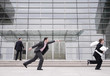Businessman chasing after a thief.