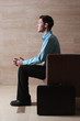 Foto: Businessman sitting on the couch. Businessman sitting on the couch.
