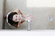 Woman having shower in the bathroom