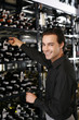 Man taking wine bottle from the wine cellar