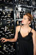 Woman choosing wine in the wine cellar