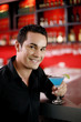 Man holding a glass of cocktail