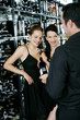 Man choosing wine for his friends at wine cellar