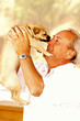 Man carrying up his dog