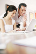 Couple using laptop