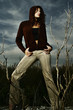 Woman with hooded jacket posing for the camera