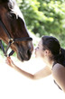 Woman kissing her horse
