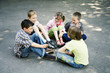 Children sitting in a circle playing
