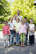 Male teacher posing with his students