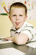 Boy sticking out his tongue at the camera