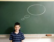 Boy standing in front of a blackboard with thought bubble
