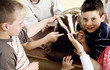 Children looking at a bear model