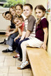 Boys and girls sitting on the bench