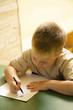 Boy colouring in the classroom