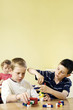 Children assembling plastic blocks