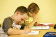 Children writing in the classroom