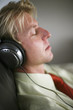 Businessman with headphone taking a nap