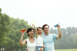 Family of three with paper planes