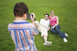 Boy recording images of young couple