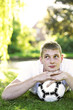 Photo: Man resting head on ball, dreaming Man resting head on ball, dreaming