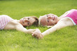 Girls lying on the grass