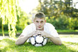 Photo: Man resting head on ball, dreaming Man resting head on ball, dreaming