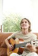 Young man playing the guitar