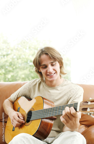 Photo: Young man playing the guitar Young man playing the guitar