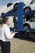 Foto: Man checking condition of vehicles Man checking condition of vehicles