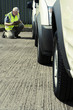 Man checking the condition of vehicle