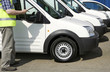 Photo: Man checking the condition of vehicle Man checking the condition of vehicle
