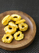Dried pineapples on brown plate
