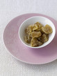 Stem ginger in white bowl pink plate