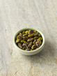 Pistachios in green bowl