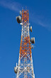 Telecommunications tower under a blue sky. Telecommunications tower under a blue sky.