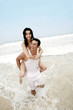 Man carrying his girlfriend on his back