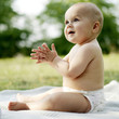Baby boy smiling while clapping hands