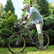 Senior man cycling in the park