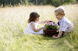 Children with a basket of flowers