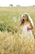 Girl blowing bubbles in the field
