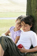 Photo: Boy and girl reading a book Boy and girl reading a book