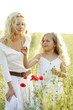 Woman and girl picking flowers