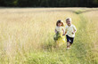 Children wandering in the meadow